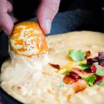 Bacon Beer Cheddar Dip - Hot cheddar cheese dip made with beer is great for pretzels, bread cubes at your favorite party or gathering. Serve in your slow cooker or fondue pot for easy dipping.
